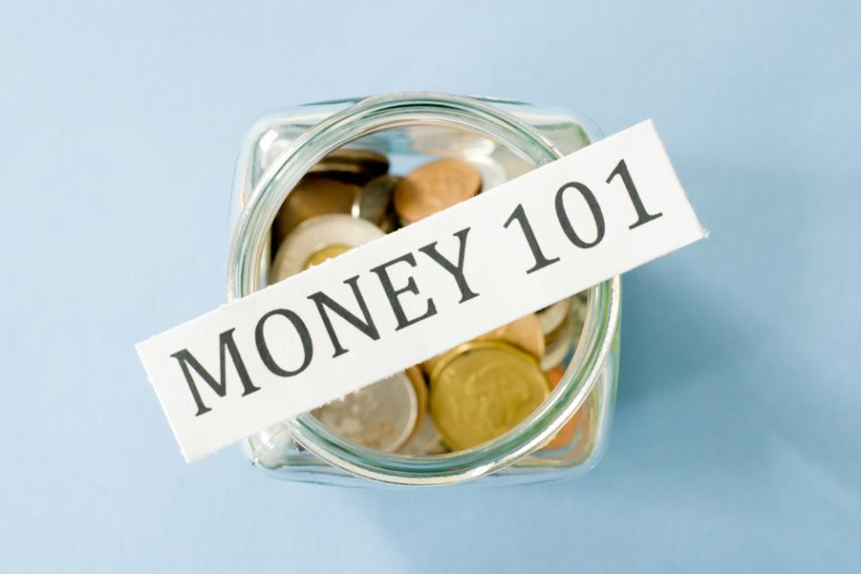 Coin jar that says MONEY 101 on top