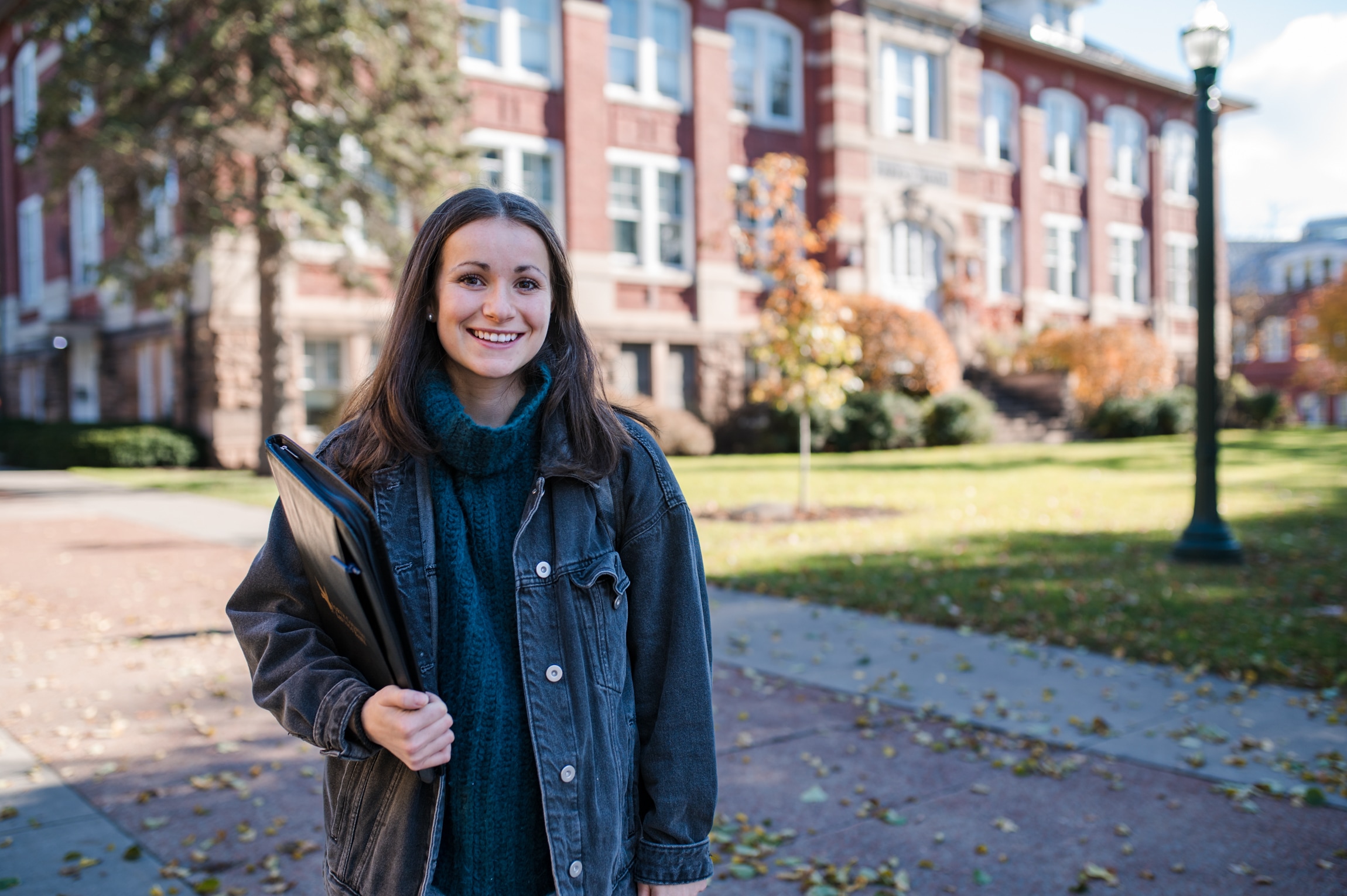 Student standing outside college