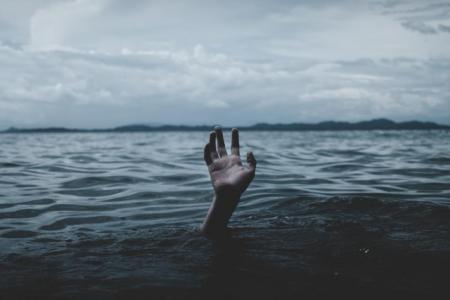 hand sticking up out of water