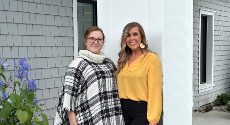 malone employees smile at camera